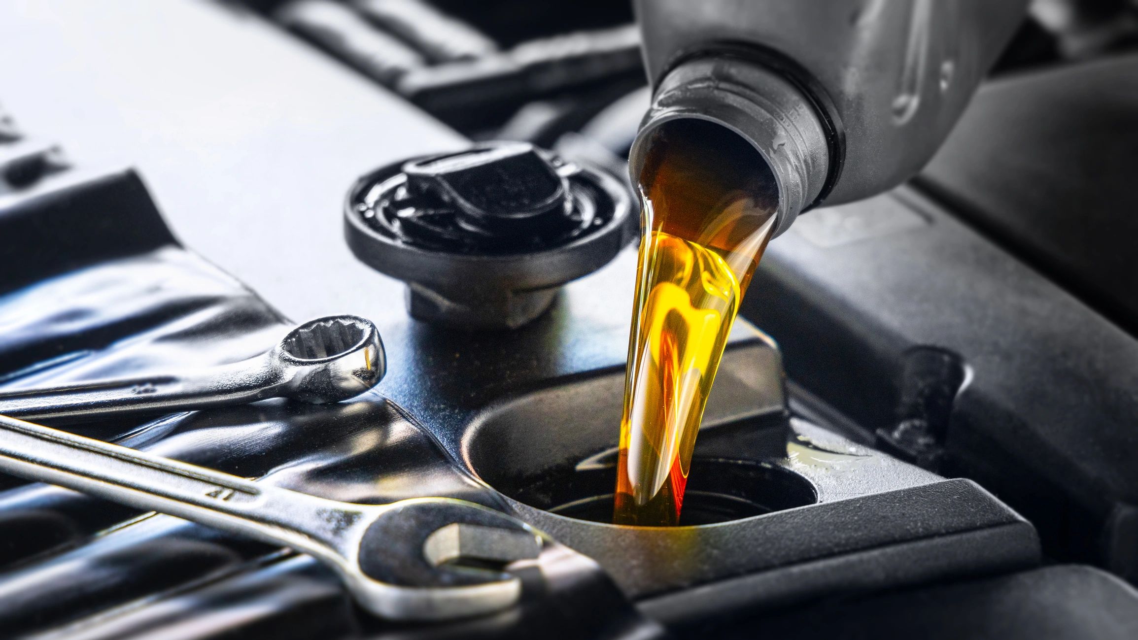 Pouring engine oil during an oil change