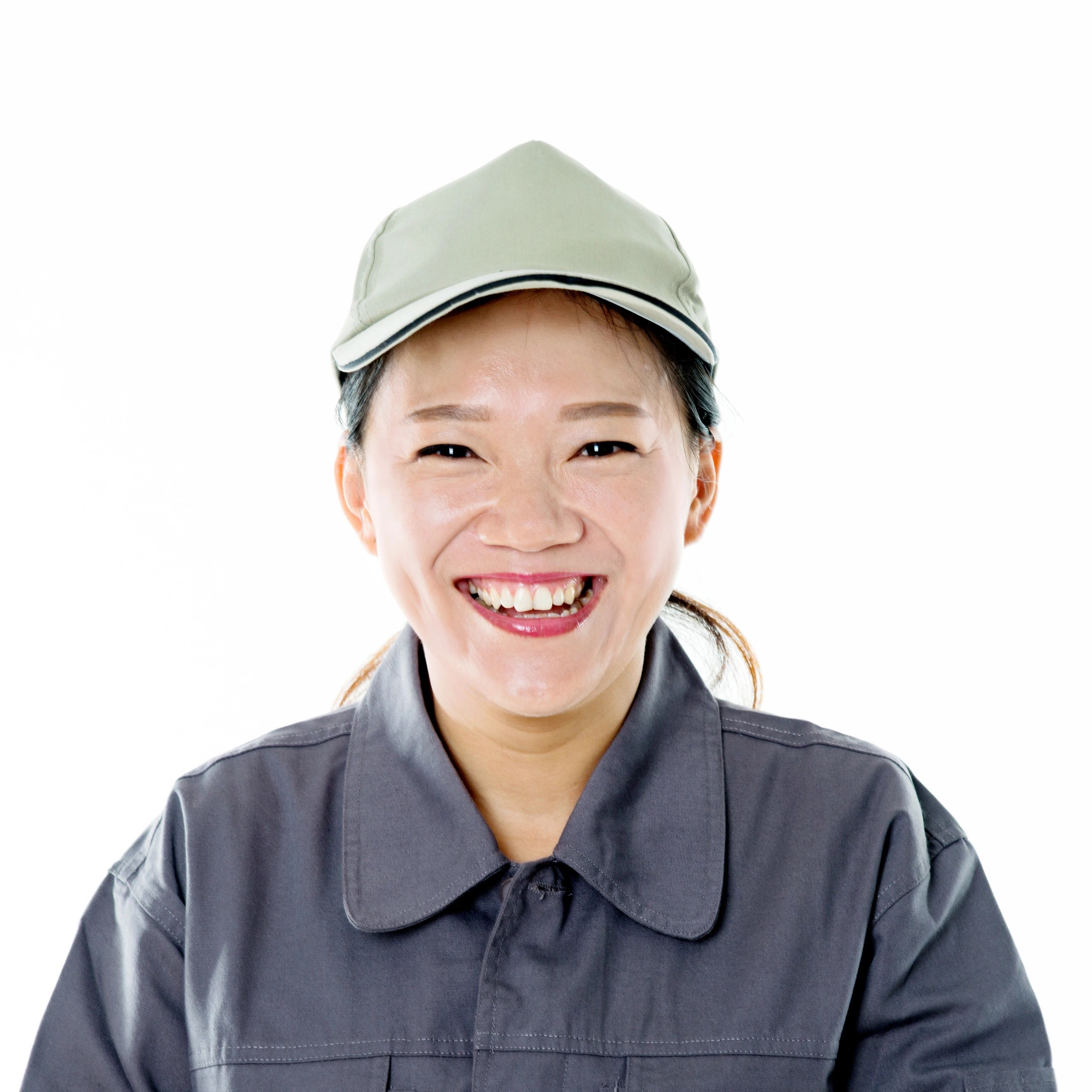 Portrait of a customer in a gray uniform smiling
